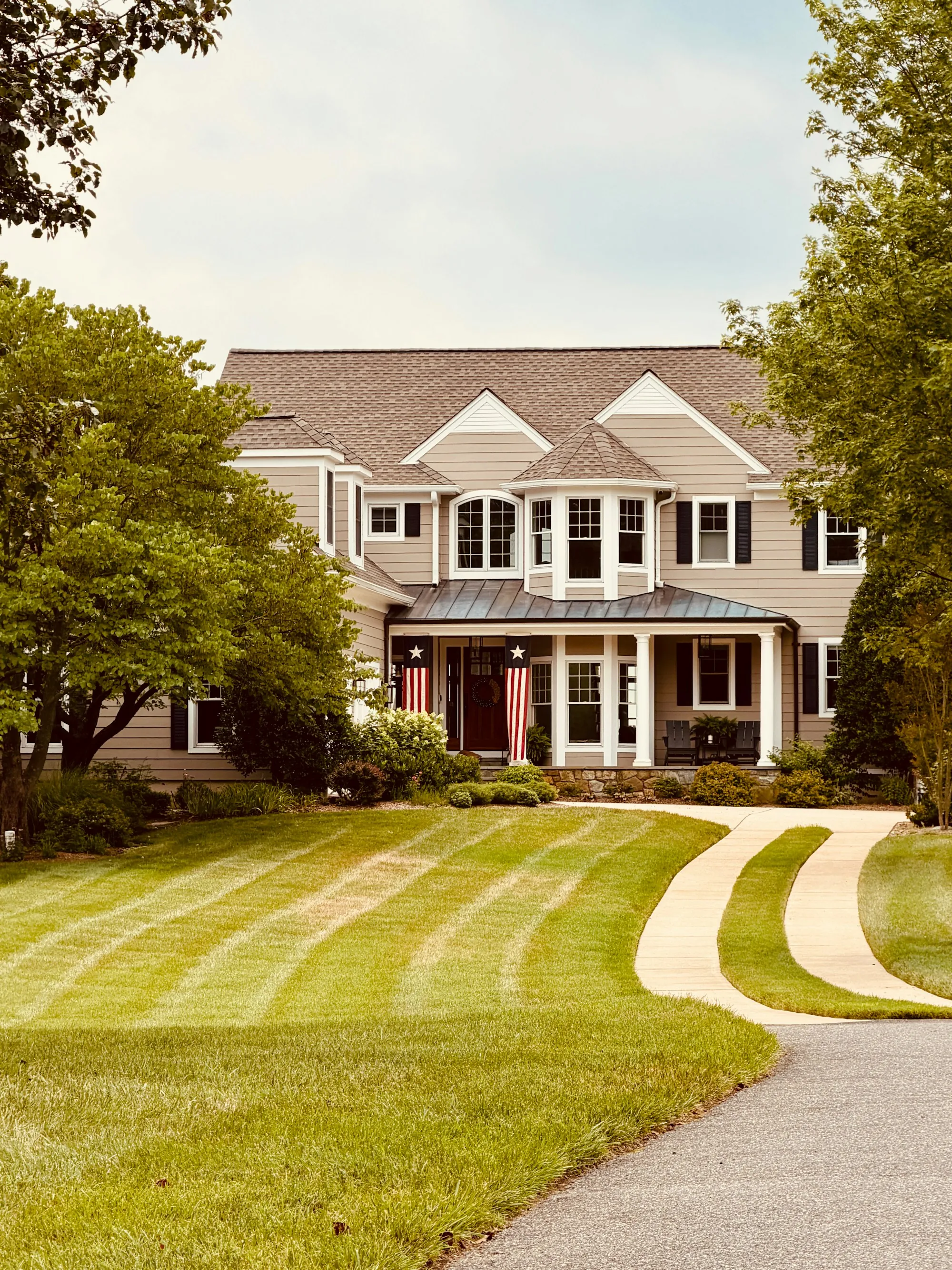 Large family home with a curved front walk
